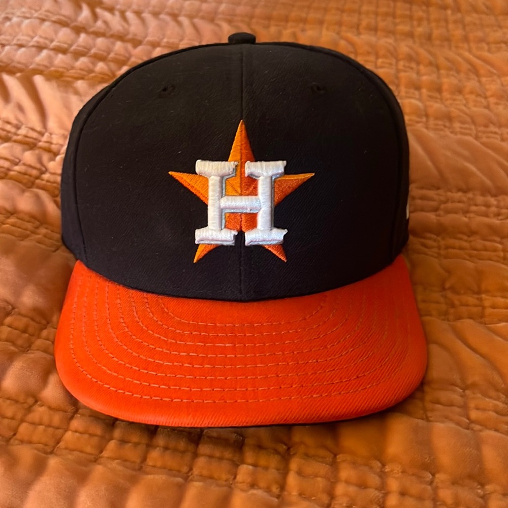 Astros New Era on field cap 7 3/8. Worn maybe twice
